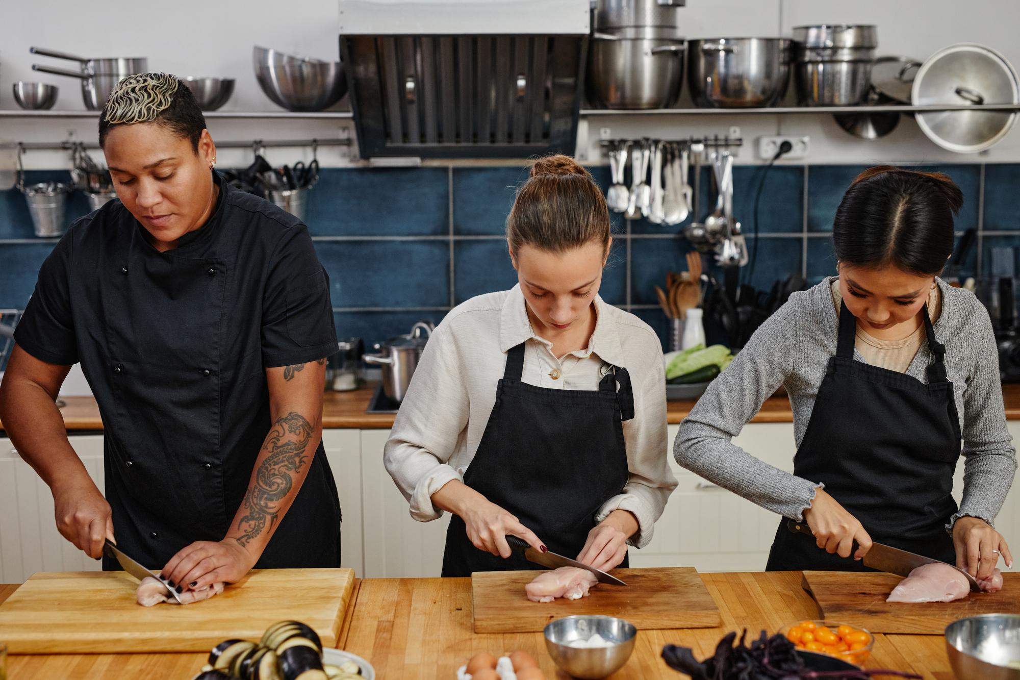 Instructor demonstrating knife technique to a small group